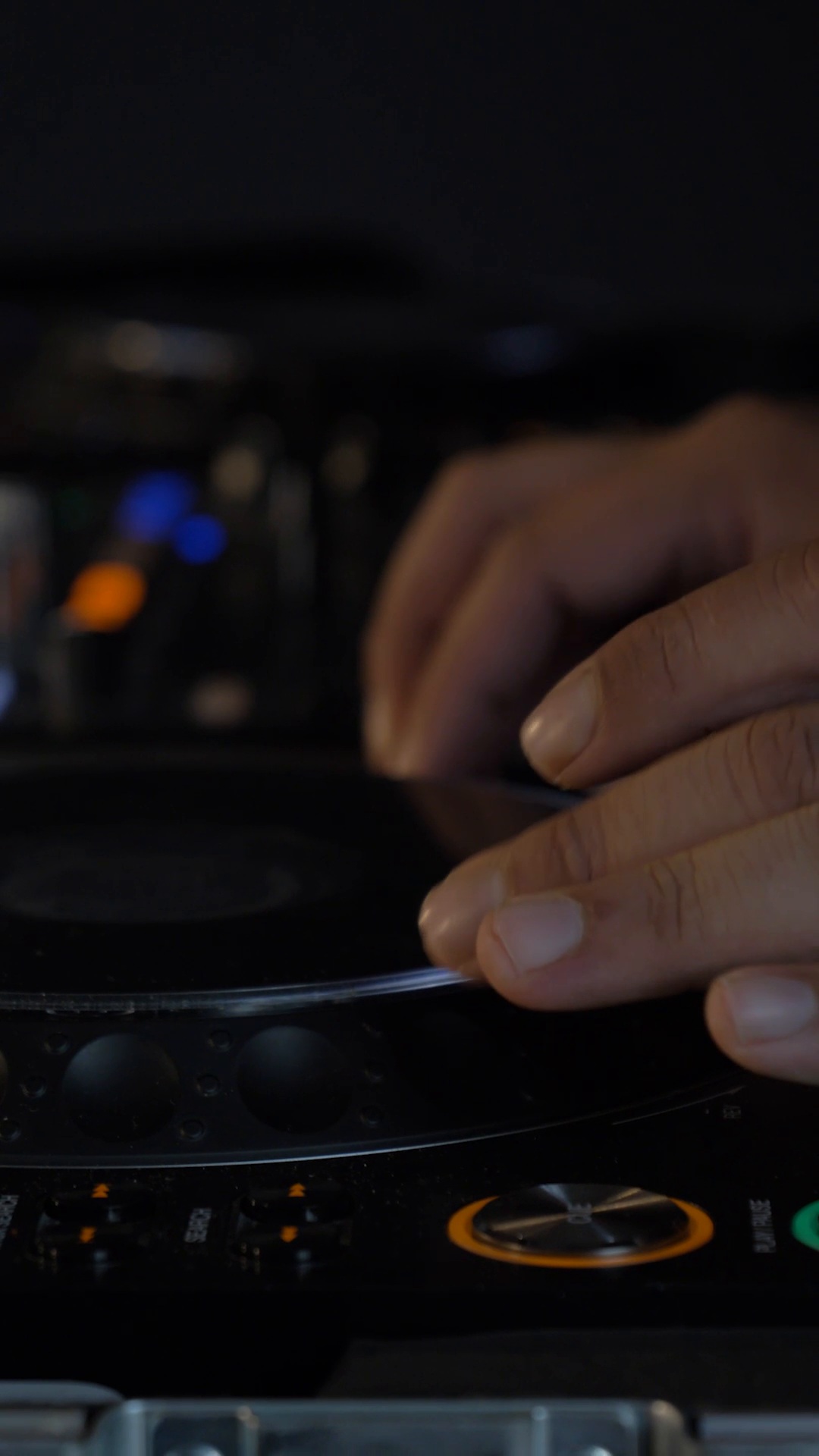Hands working at the DJ decks during Beats and Brews 2025
